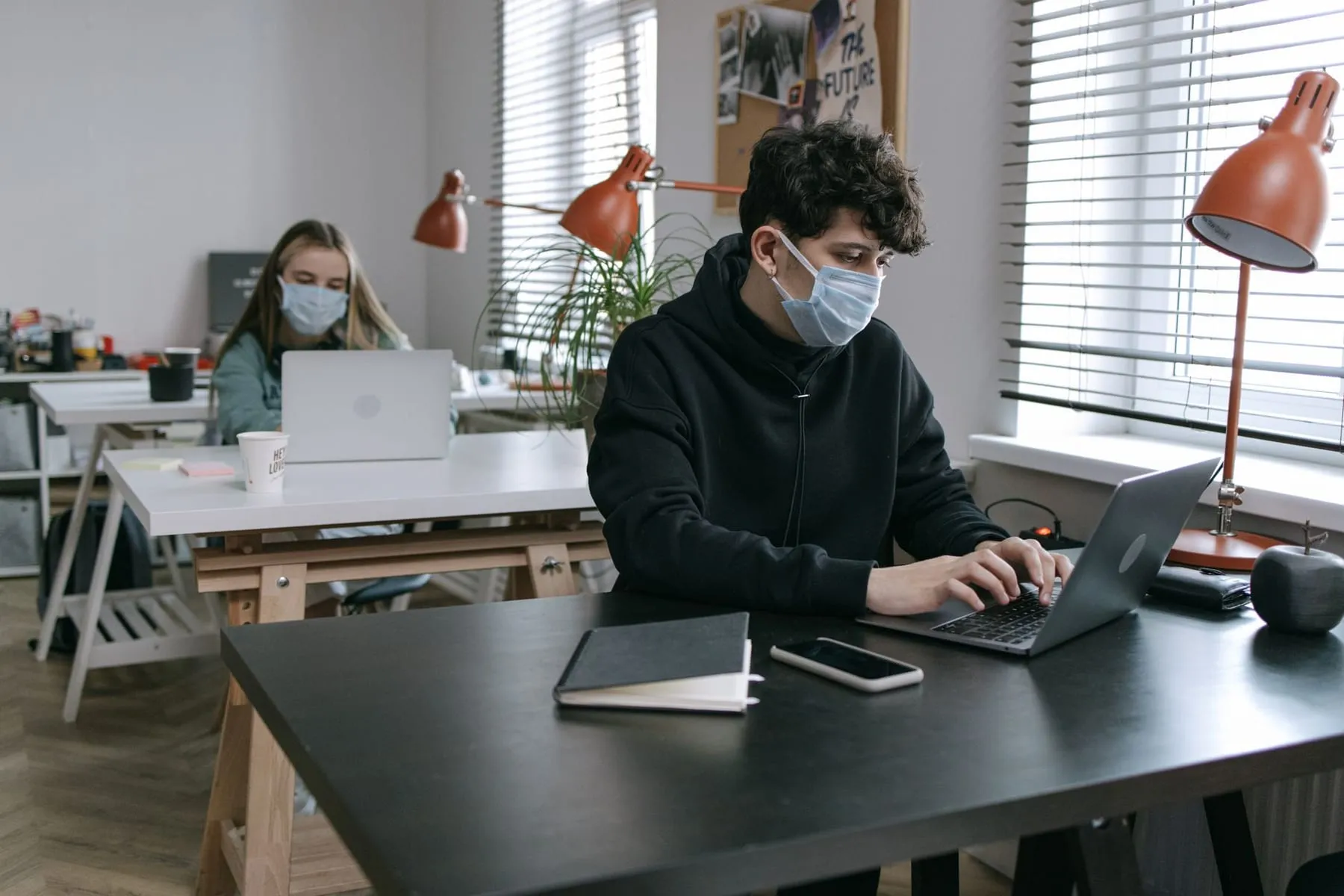 An agency office with producers working at their own desks