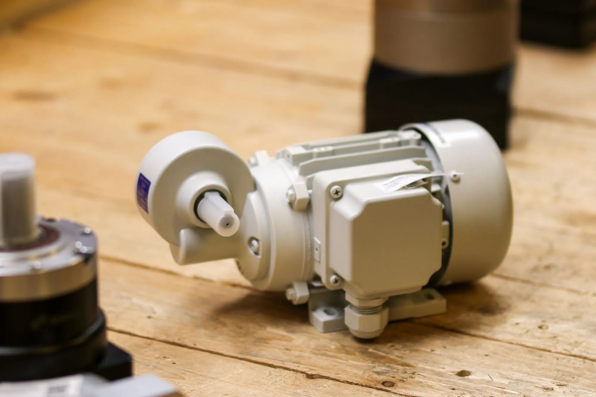An industrial electric motor on a workshop bench