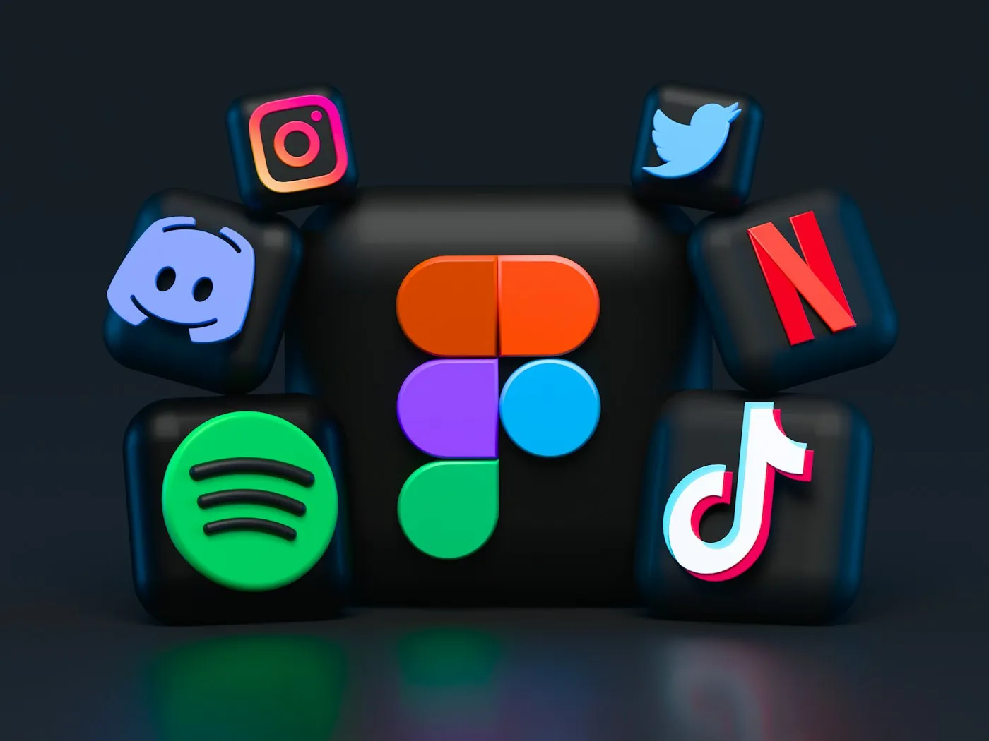 Social media icons arranged across a dark surface