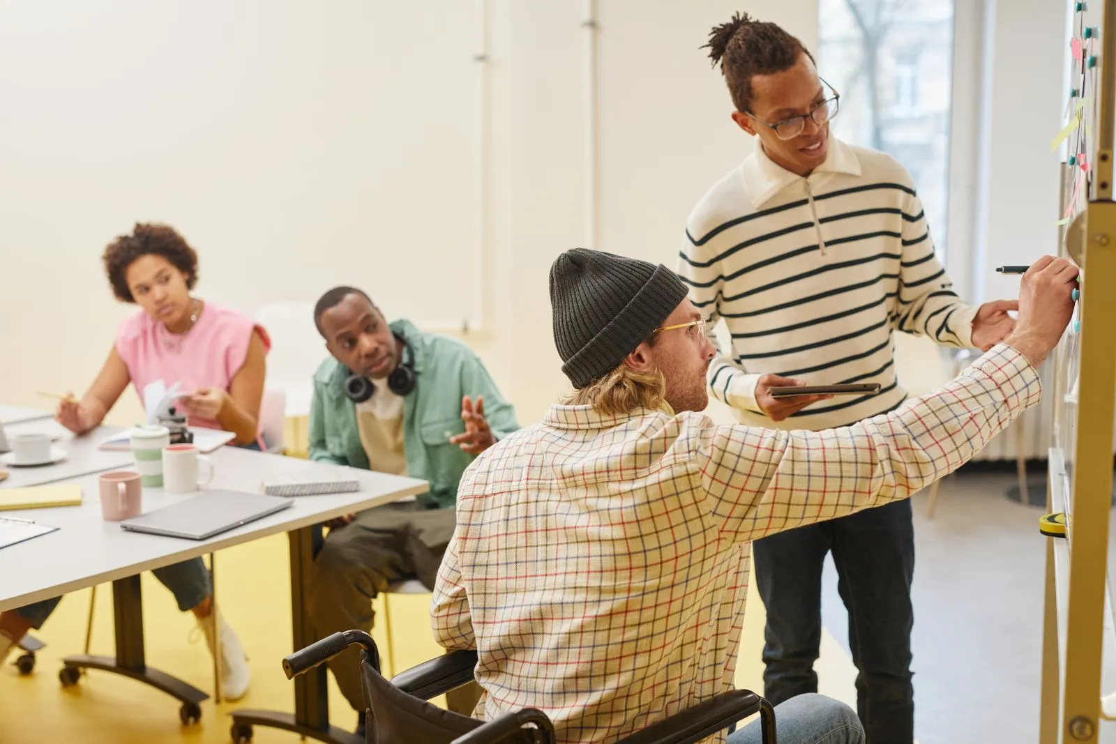 A team working through a plan together in an office